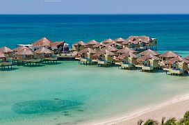 Palafitos Overwater Bungalows Catamaran, Cenote & More Inclusive (Adults Only)
